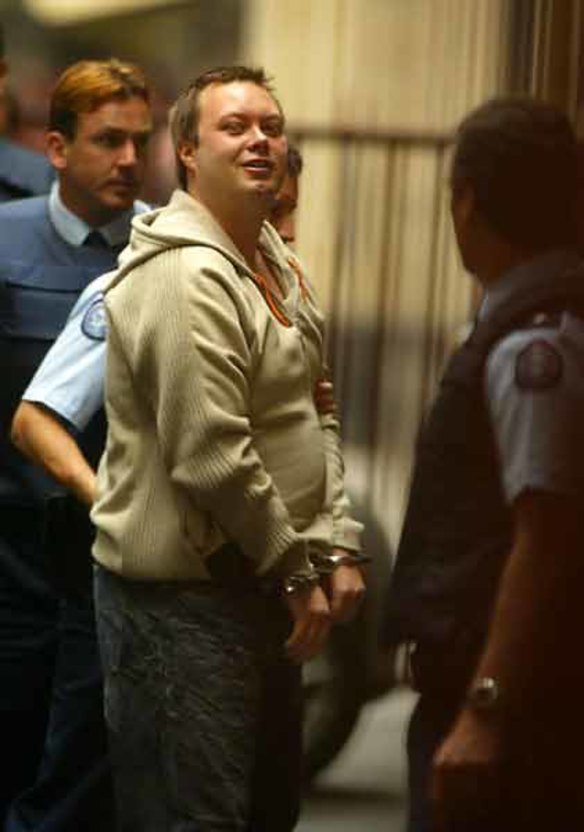 Gangland killer Carl Williams is led into the Supreme Court in December 2004.