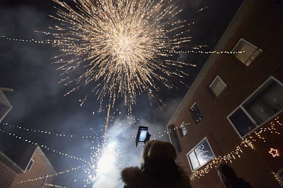 Local residents light fireworks despite the ban in The Hague, Netherlands.