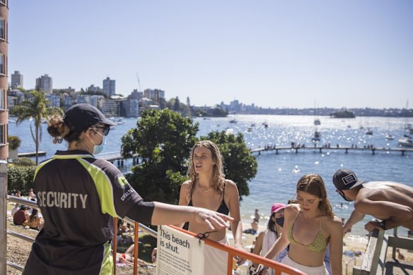 A warm Spring day, with and security managing crowds, at Murray Rose Pool (aka Redleaf pool), during Sydney's COVID lockdown.