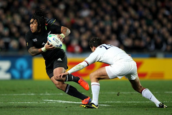 Ma'a Nonu of the All Blacks is challenged by Francois Trinh-Duc.
