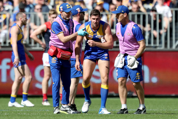 Jack Darling of the Eagles leaves the field injured.