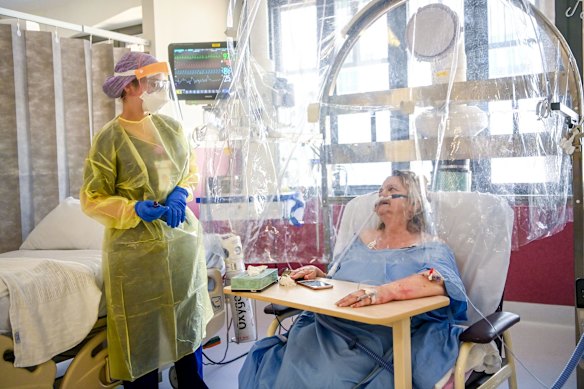 COVID-19 patient Maria Roessen who has spent ten days in hospital including seven in the ICU ward. Maria has an underlying lung condition and is very lucky to be alive thanks to being double vaccinated. Maria is being tended to by ICU nurse Montana McQuade.