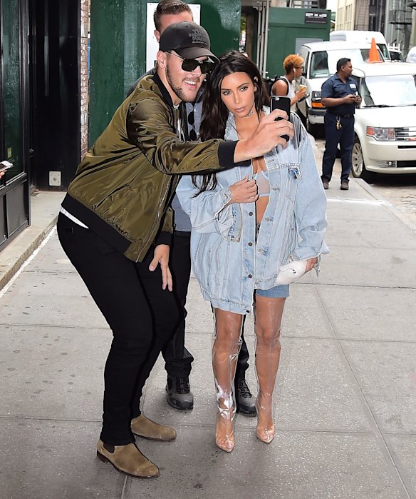 Kim Kardashian in Yeezy Season 4 shower curtain shoes. 