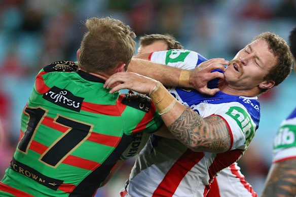 Man mountains: Tom Burgess of the Rabbitohs crashes into Korbin Sims.