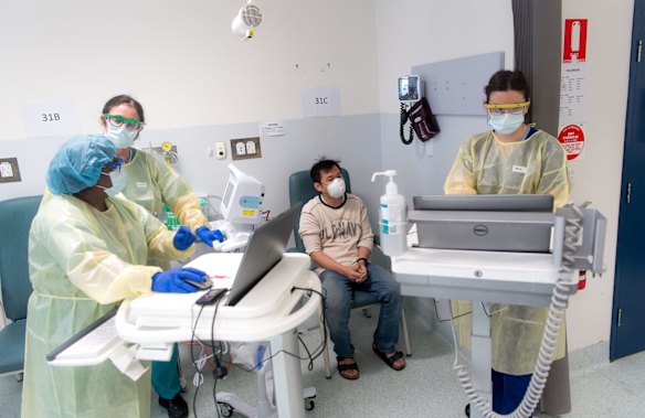 A man having a coronvirus test in the screening clinic.