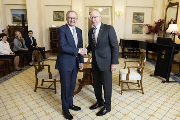 Sealing the deal: Anthony Albanese is sworn in as Australia's 31st Prime Minister during a ceremony with Governor-General David Hurley.