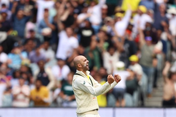 Nathan Lyon celebrates after dismissing Jos Buttler.