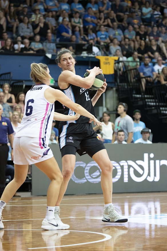 Adelaide Lightning's Steph Blicavs and Capitals' Marianna Tolo. 