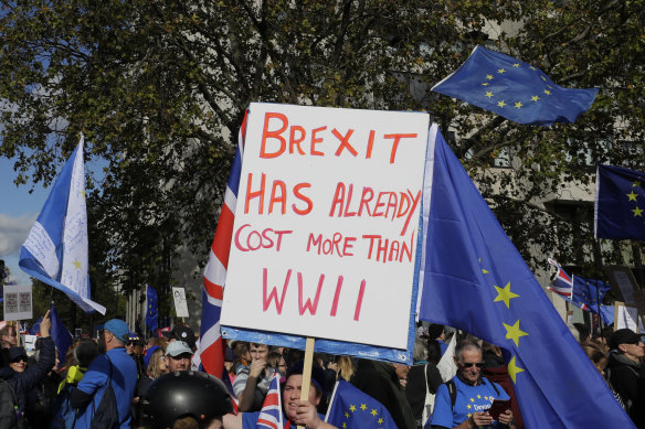 Anti-Brexit demonstrators carry placards and EU flags in London on Saturday.