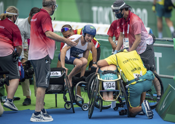 Kendall Gretsch gets out of her chair to check on Lauren Parker after the race.