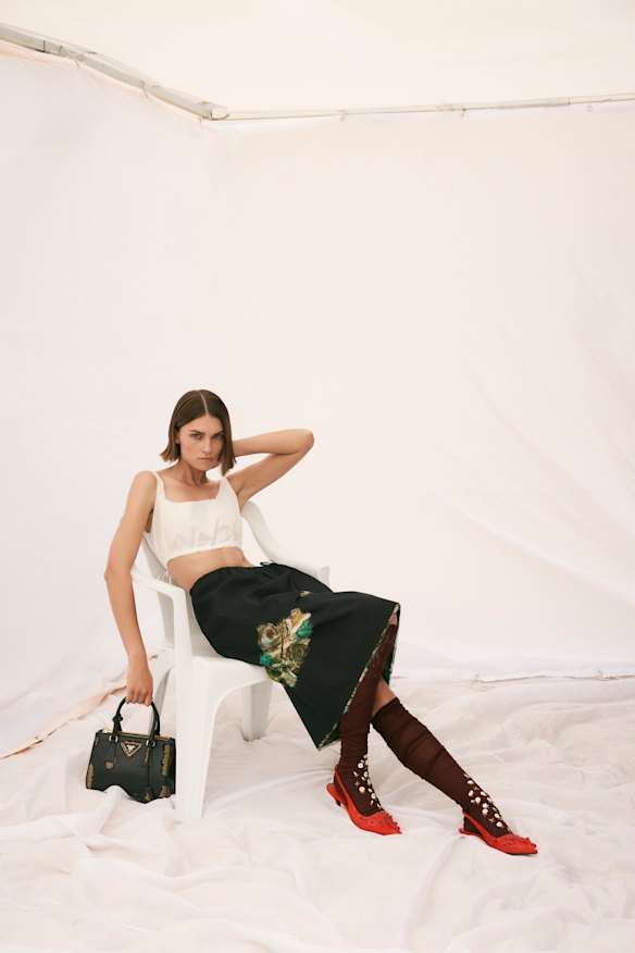 Prada top, skirt, socks, shoes and bag.