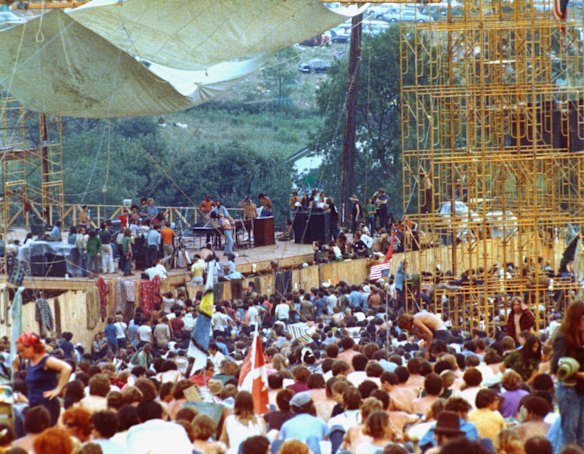Concert goers surround the stage as Joe Cocker performs.