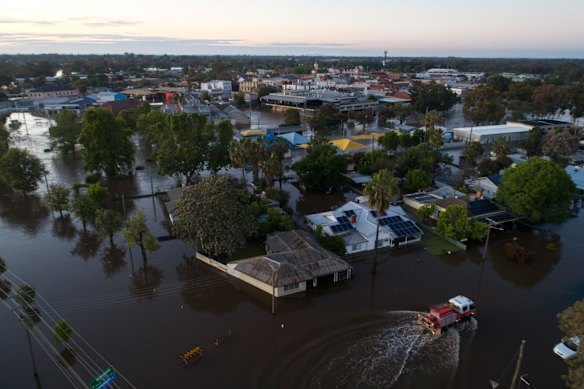 Dawn reveals heighten flood waters in Forbes, Saturday November 5, 2022.