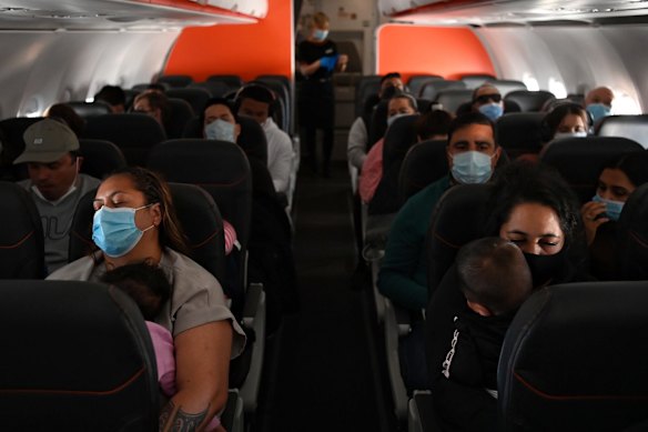 Lisa Te Tai and her granddaughter Manaia Taalili, left, on board their flight to Auckland. 