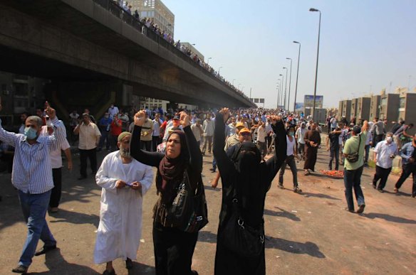 Supporters of Egypt's ousted President Mohammed Morsi chant slogans during clashes with security forces near the largest sit-in by supporters of Morsi in the eastern Nasr City district of Cairo, Egypt.