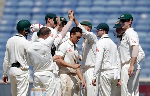 Australia's Steve O'Keefe, centre, celebrates after Ajinkya Rahane's wicket.