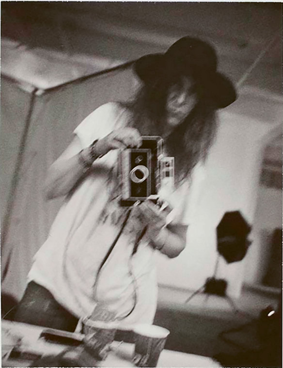 Patti Smith with the Polaroid Land 250 camera that was her “working companion” for 20 years.