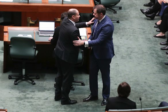 Minister for Environment and Energy Josh Frydenberg embraces Labor MP Ed Husic.