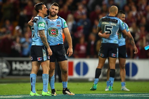 James Maloney and Mitchell Pearce of the Blues embrace after game three of the State Of Origin series.