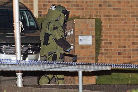 On officer inspects the scene.