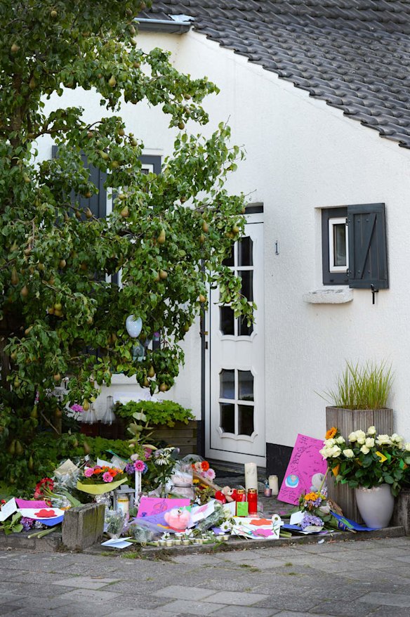 Flowers are layed by the house of a Dutch family killed in the crash of the Malaysian Airlines flight MH017 in eastern Ukraine, in Neerkant, The Netherlands, on July 2014. The father, mother and four children of the same family were killed in the crash of the Malaysian Airlines flight MH017 from Amsterdam to Kuala Lumpur, along with 298 other people.