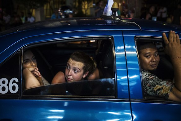 Schoolies in Bali getting a taxi through the main st in Legian, 2014.