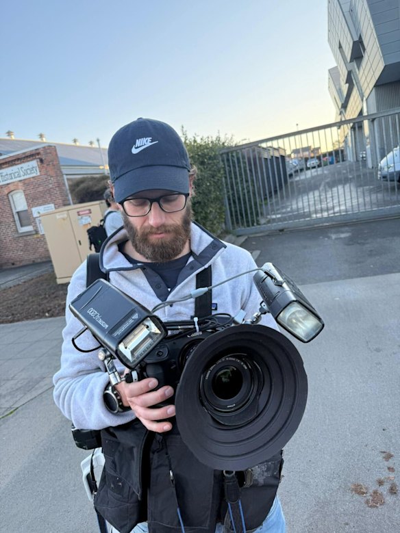Martin Keep with the equipment he used to photograph Erin Patterson in the back of the police van.