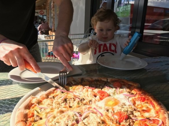 #4: Little Edith P enjoying a slices of Amica Cafe pizza.