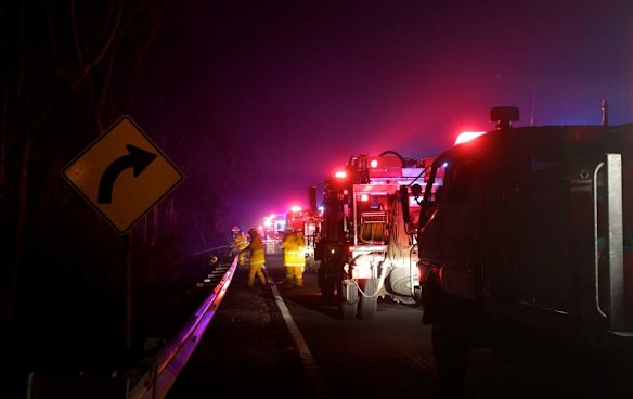 RFS fire crews in position along the Bells Line of Road west of Mt Tomah last night as fire threatened to jump the road from ember attack.