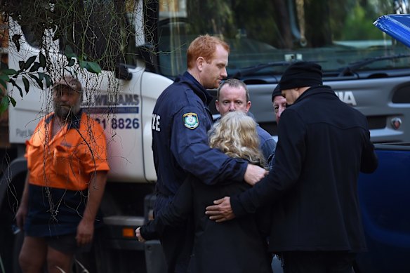 NSW Detectives embrace Matthew Leveson's parents Mark and Faye after locating the possible burial place of their son.