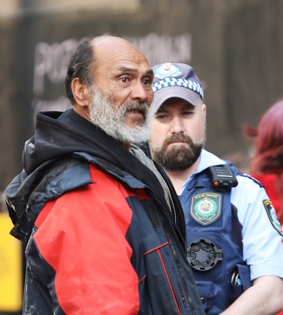 Leader of Tent City Lanz Priestly talks to police at Martin Place.