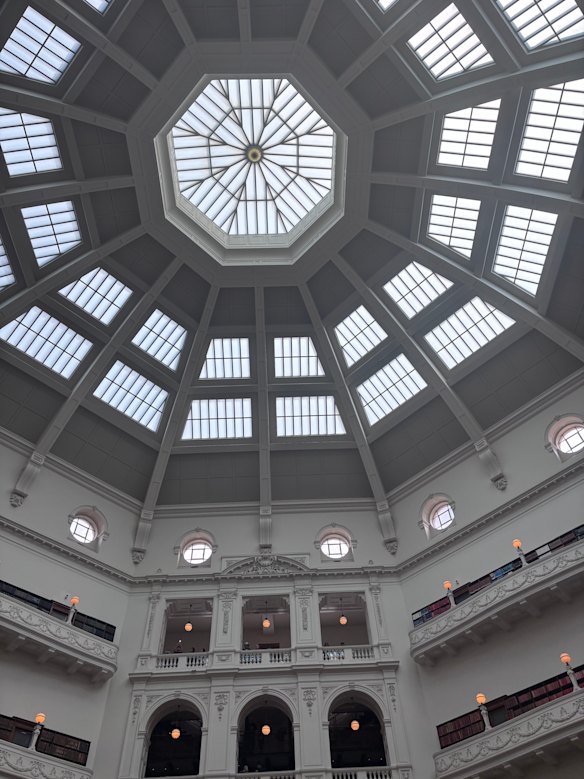 The great dome spills light into the hushed reading room at the State Library of Victoria.