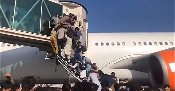 Scenes at Kabul airport in Afghanistan as Afghans try to leave after the fall of Kabul to the Taliban. 


