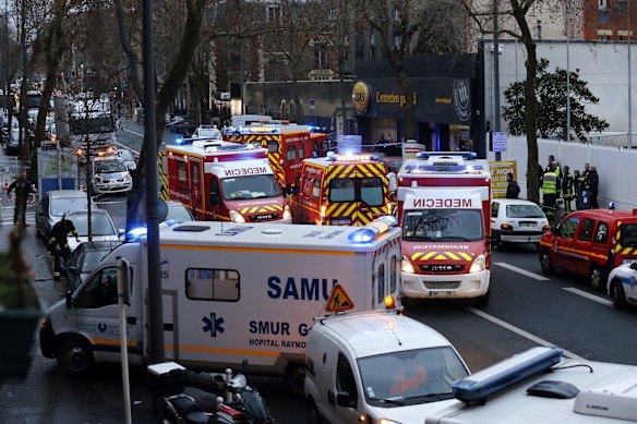 Police, paramedics and firefighters at the scene of the shooting in the south Paris on Thursday, January 8. 