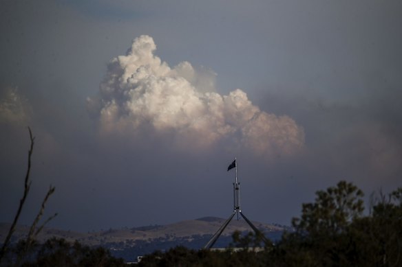 Bushfire smoke from North Black Range bushfire near Braidwood seen from Canberra with Parliament House in the foreground.