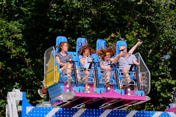 Lucy with partner Branko enjoying one of the rides with daughters , Amy, 11 and Laura, 9  at Moomba.