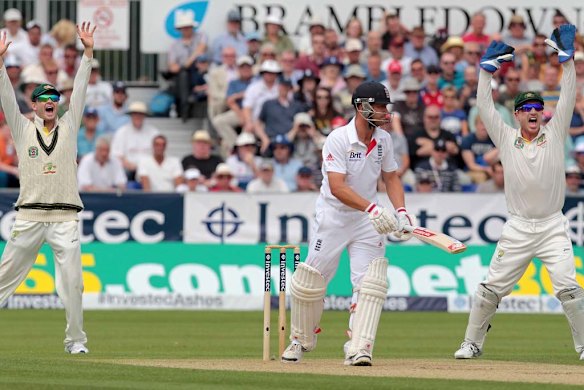 Michael Clarke and wicket-keeper Brad Haddin appeal successfully for the wicket of Jonathan Trott.