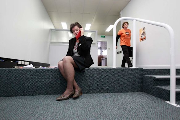 Cathy speaking on the phone with a journalist whilst her electoral office is cleared out in Wangarratta.