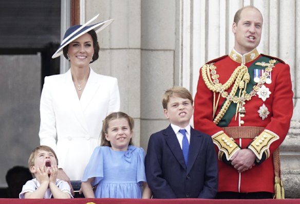 The younger royals appear hard to impress on the Buckingham Palace balcony. Prince Louis, Princess Charlotte and Prince George with their parents, the Duke and Duchess of Cambridge.