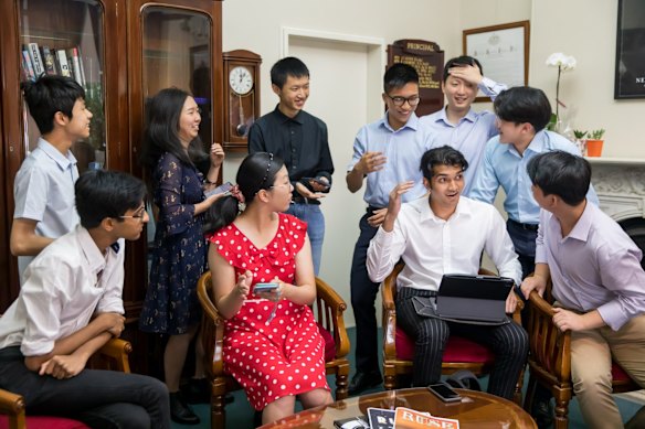 James Ruse Agricultural High School tops the state for the 25th year running. Principal Rachel Powell with some the students getting the results in her office.