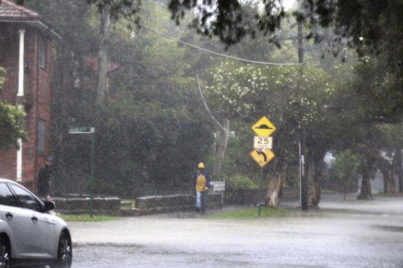 Heavy rain floods the road at Dibble street and Riverside Cresent, Marrickville in the inner west of Sydney.