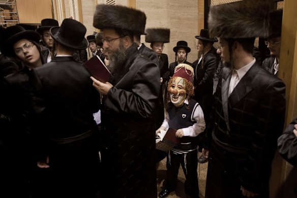 Ultra-Orthodox Jewish men and boys gather at a yeshiva, a rabbinical seminary.