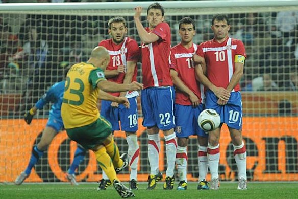Mark Bresciano takes a free kick.