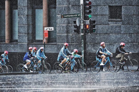 Riding in heavy rain in Sydney CBD in 2016.