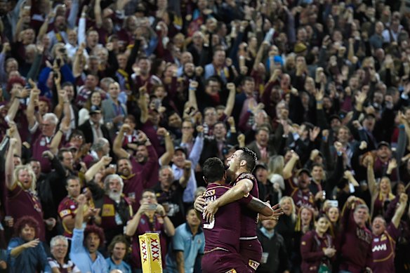 Dane Gagai of the Maroons celebrates scoring a try with Cooper Cronk