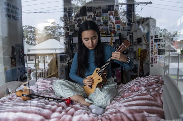 MLC student Zoe Hannam at home. Isolation didn't stop her school choir from rehearsing via zoom, with the head of music pulling together an arrangement of ‘Sweet Quarantine’ as a parody of ‘Sweet Caroline’.  She says "When the school community was apart, music was
needed to bring people together again and spread a sense of hope throughout the school". 