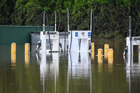 Petrol pumps stand partially submerged in Camden.