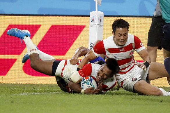 Jubilant Japan celebrate after scoring another try. 