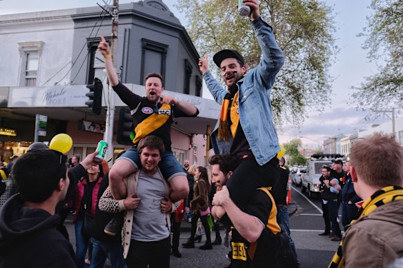 Richmond supporters celebrating their teams win over Adelaide during the AFL Grand Finals in Swan st Richmond.  Photo Luis Enrique Ascui