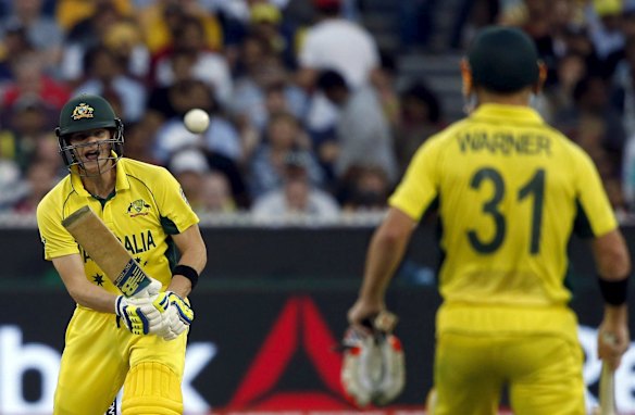 Steve Smith watches anxiously as he hits an uppish shot towards mid-on.